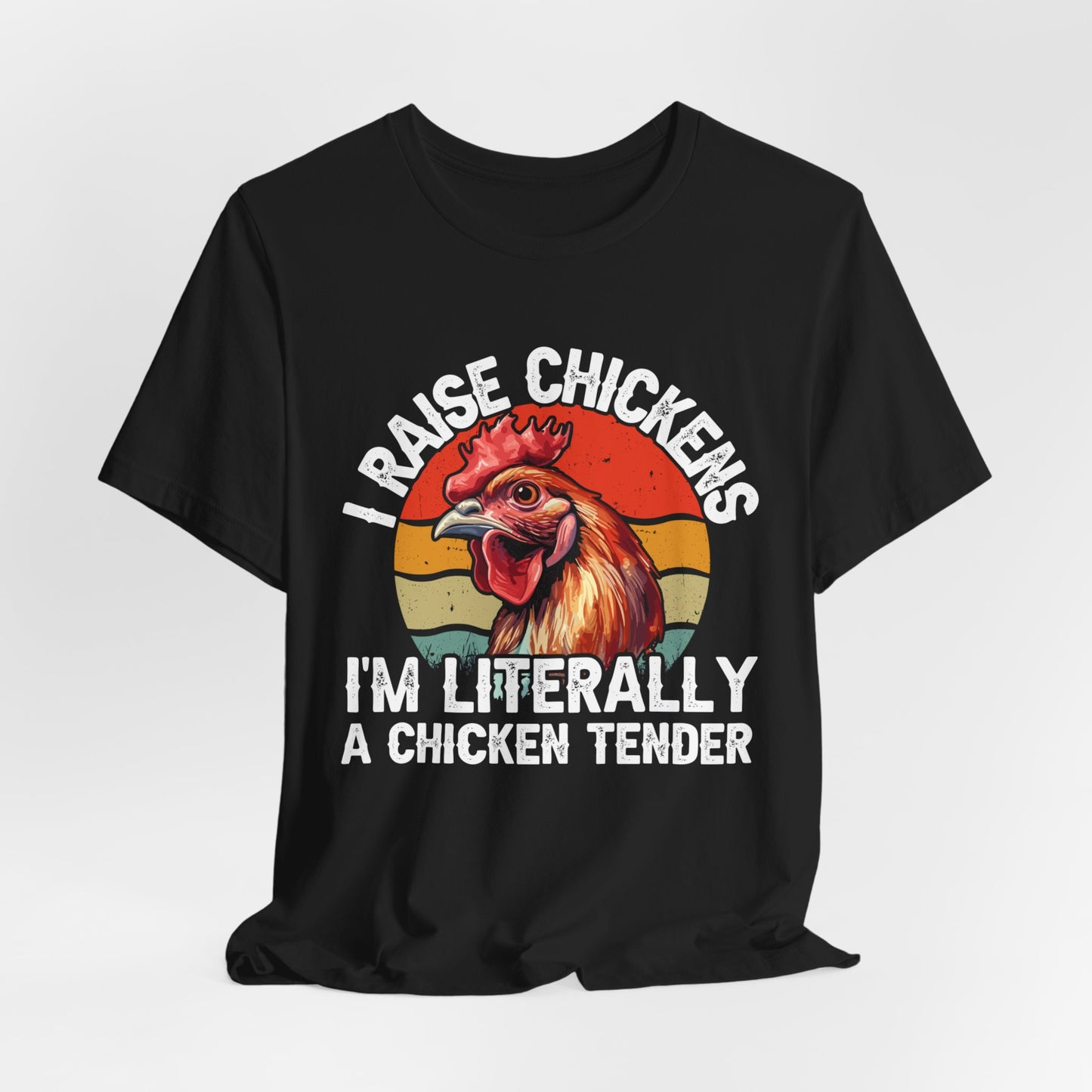 black shirt with I raise chickens I'm Literally a chicken tender on the front in distressed print. There is a rooster in the design.